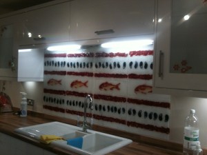 Handmade glass splashback with red mullet and mussels