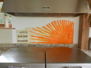 Handmade Bespoke Orange Sunrise Glass Splashback with motto "I Watch for the Sunrise"