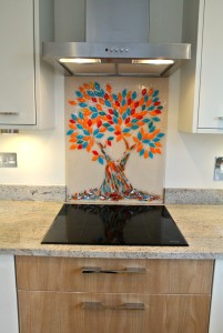Bespoke, hand made Tree of Life glass splashback in turquoise and orange, in a white kitchen