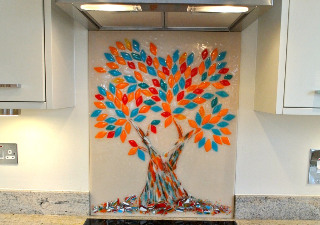 Bespoke, hand made Tree of Life glass splashback in turquoise and orange, in a white kitchen